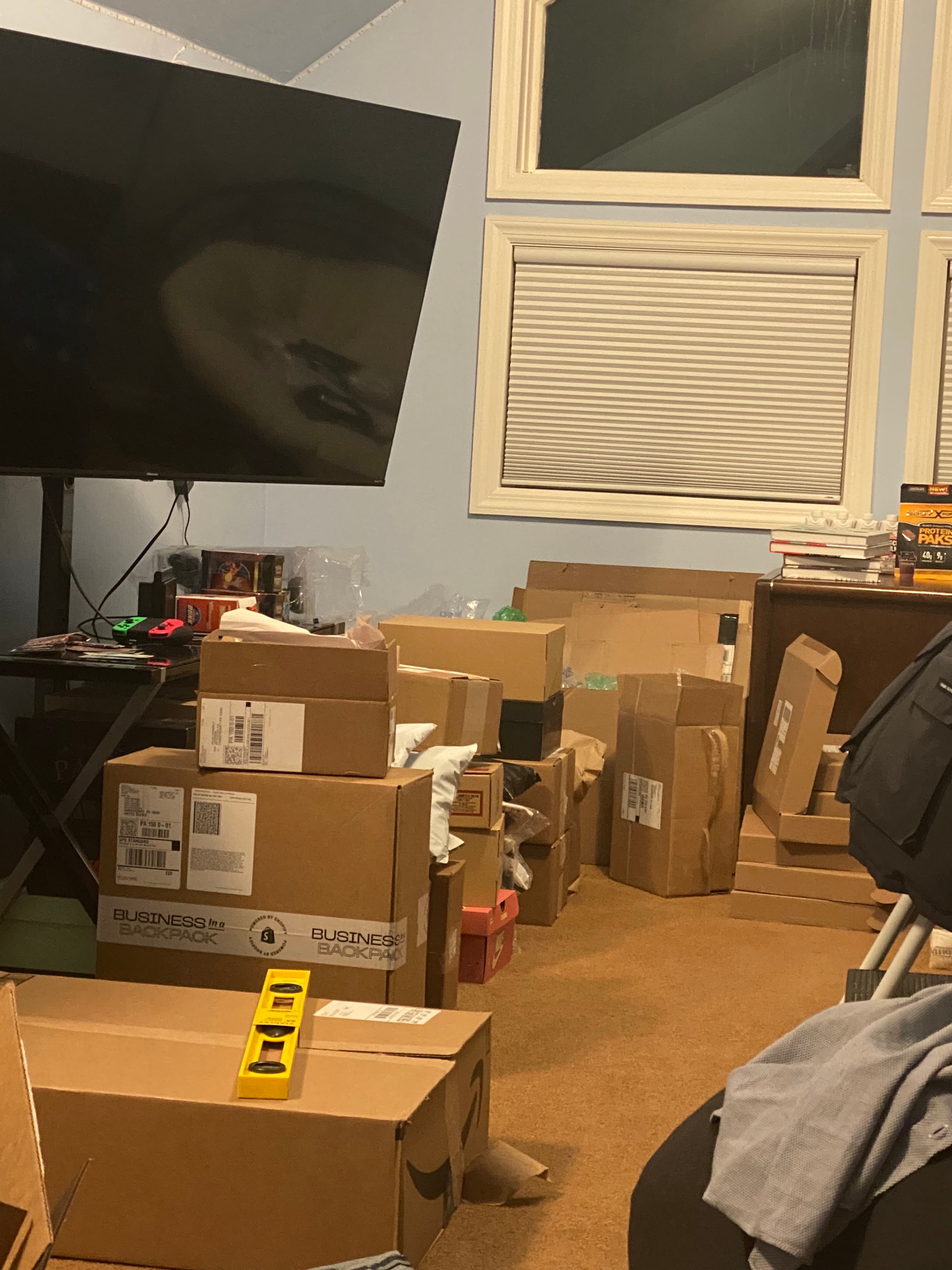 Home office filled with shipping boxes showing humble beginnings