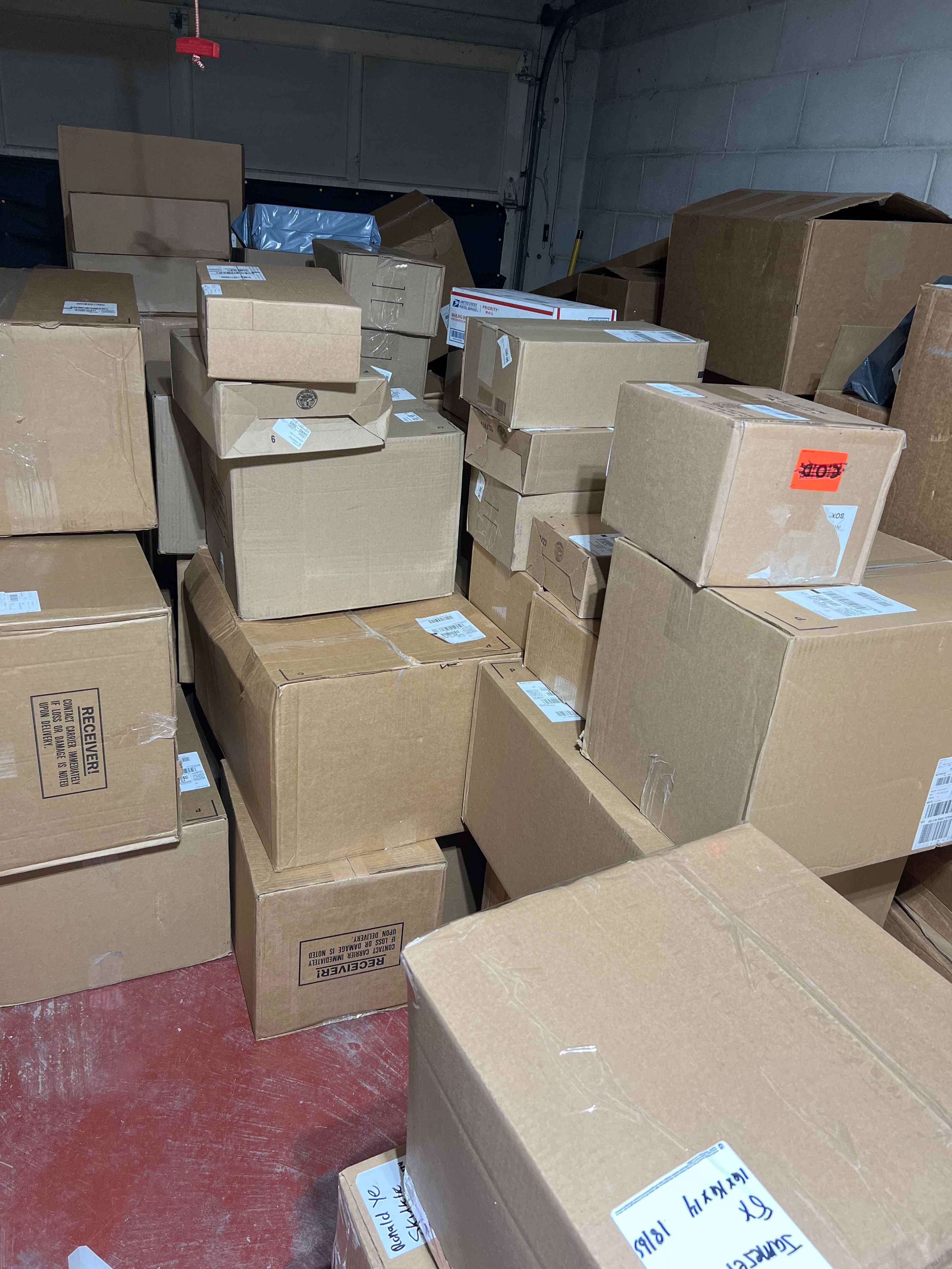 Professional warehouse filled with organized shipping boxes showing business growth